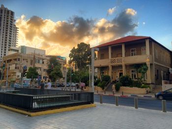 View of buildings against cloudy sky