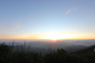 Scenic view of mountains against sky during sunset