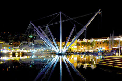 Illuminated bridge at night