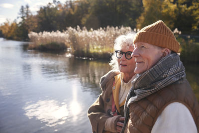 Senior couple next to lake in park