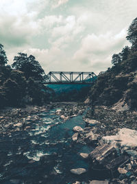 Bridge over river against sky