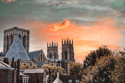 Buildings against sky during sunset