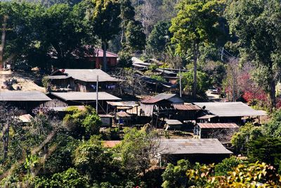 High angle view of townscape and trees in forest