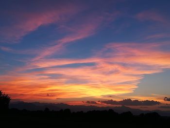 Scenic view of dramatic sky during sunset