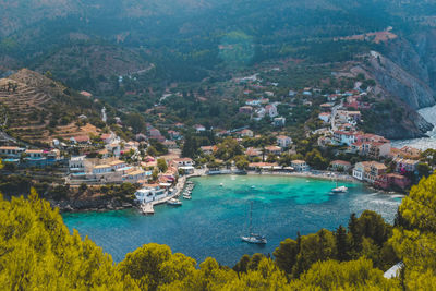 High angle view of sea and buildings in city