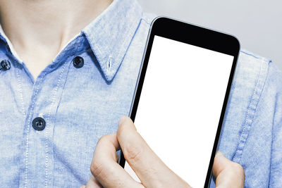 Low section of person using mobile phone