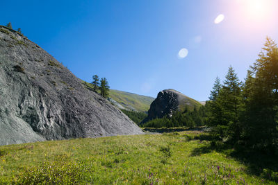 Scenic view of land against clear blue sky