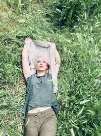 Portrait of teenage girl standing on field