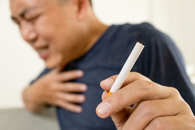 Close-up of man using mobile phone