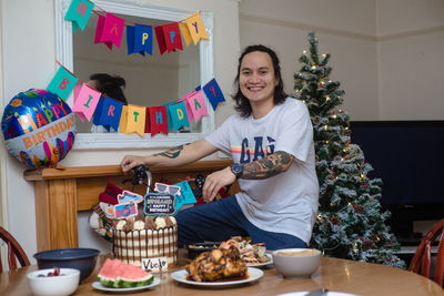 Portrait of a smiling young woman holding food