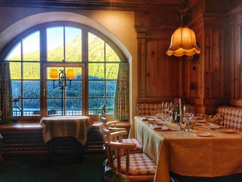 Empty chairs and table in restaurant