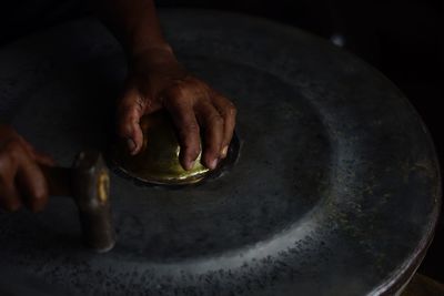 Close-up of man with gong