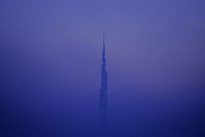 Tower against clear blue sky at dusk