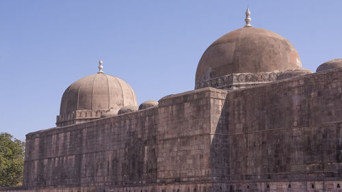 Low angle view of mosque against clear sky