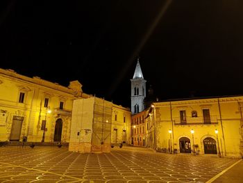 Illuminated buildings in city at night