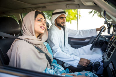 Couple sitting in car