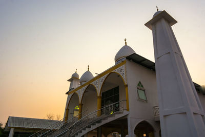 Low angle view of bell tower against sky