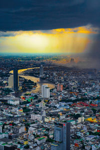 High angle view of city at sunset