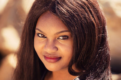 Close-up portrait of a smiling young woman