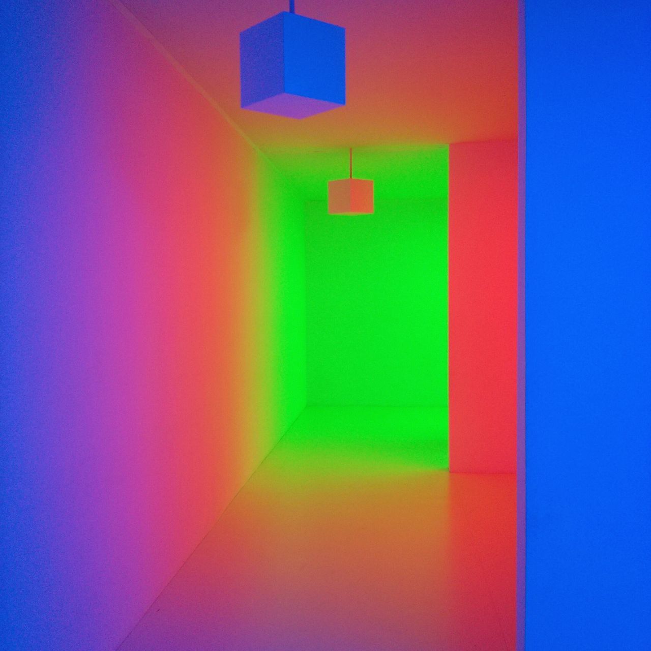 blue, indoors, wall - building feature, multi colored, illuminated, wall, red, built structure, architecture, communication, no people, colorful, lighting equipment, green color, copy space, guidance, yellow, pattern, close-up, geometric shape