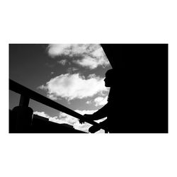 Silhouette of power lines against sky
