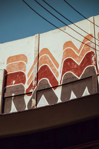 Low angle view of building against blue sky