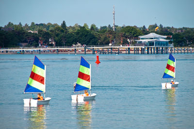 Children enjoying in sailboat at sea