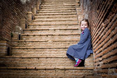 Portrait of boy on steps