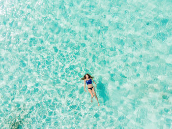 High angle view of man swimming in pool