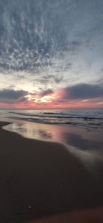 Scenic view of beach against sky during sunset