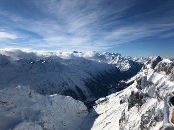 Scenic view of snowcapped mountains against sky