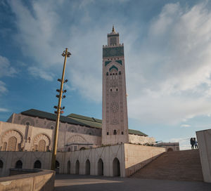 Low angle view of hassan ii mosque against sky - casablanca, morocco