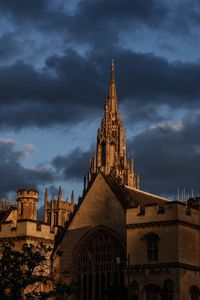 Low angle view of bell tower against sky