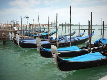 Boats moored in canal