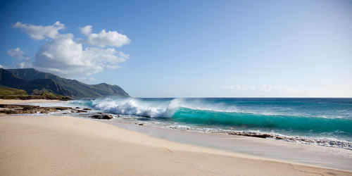 Scenic view of sea against blue sky