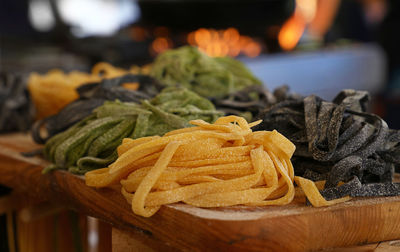 Close-up of raw pasta on table