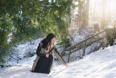 Woman on snow covered field