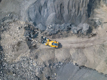 High angle view of earth mover digging land