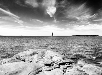 Scenic view of sea against cloudy sky