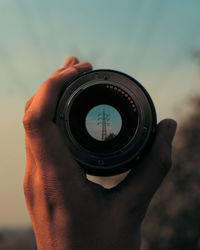 Close-up of hand holding camera