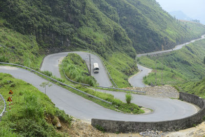 High angle view of road amidst mountains