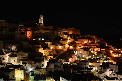 High angle view of illuminated buildings in city at night