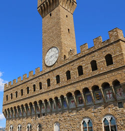 Low angle view of historical building against blue sky