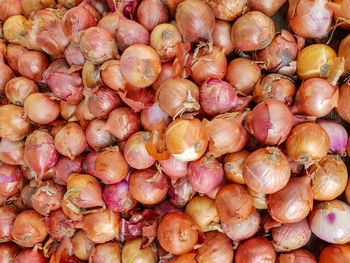 Full frame shot of onions for sale at market stall