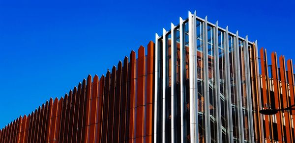 Low angle view of building against clear blue sky