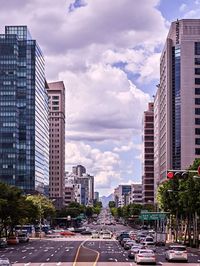 City street and modern buildings against sky