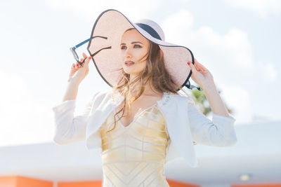 Young woman wearing hat