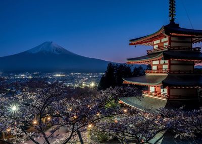 Ancient building against mountain at night