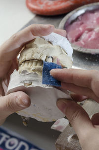 Close-up of hand holding ice cream