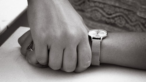 Hands of woman wearing a watch